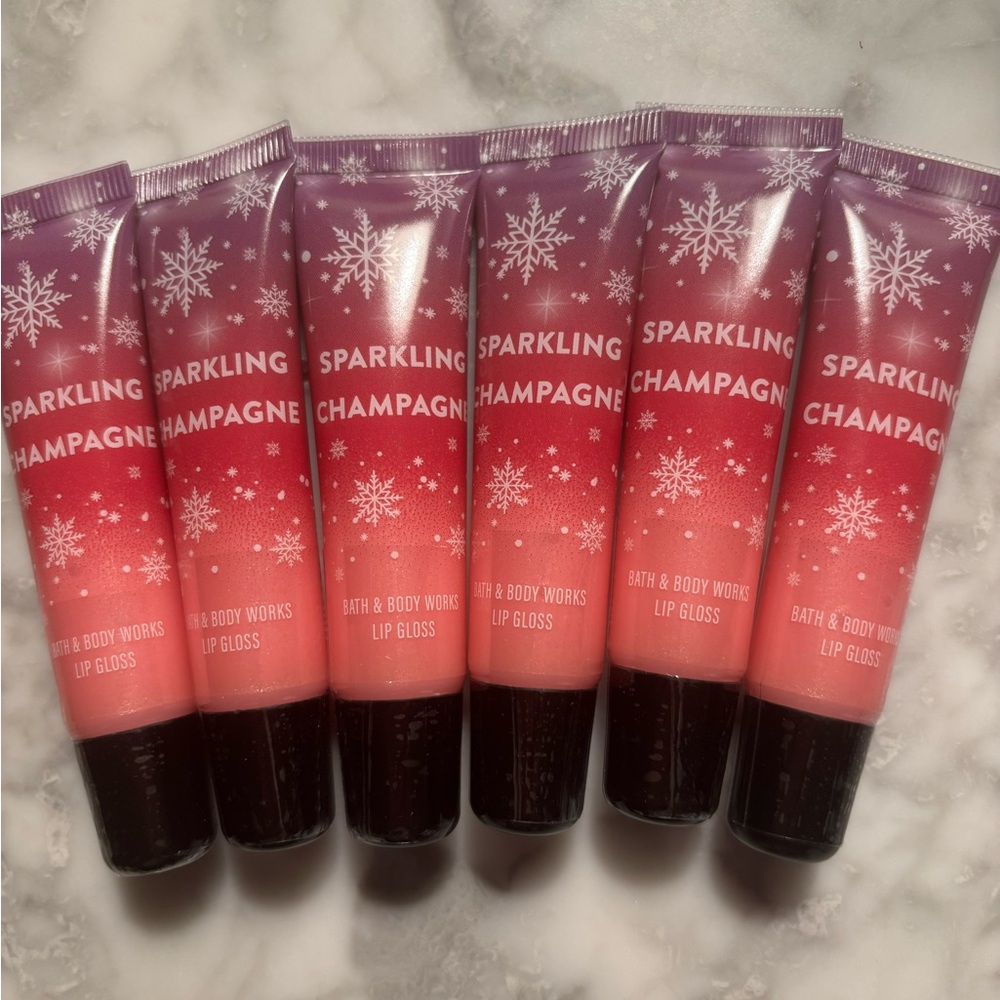 A Pack Of 6 Units of Bath & Body Works Sparkling Champagne Lip Gloss - Pink